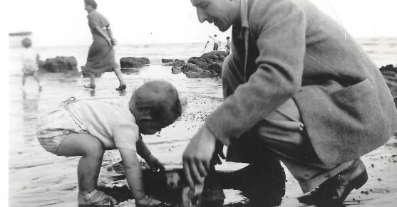 On the beach with his father