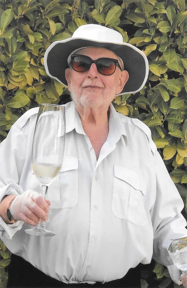 With a glass of wine