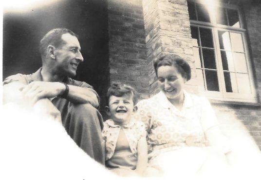 With his father and his aunt Sylvia