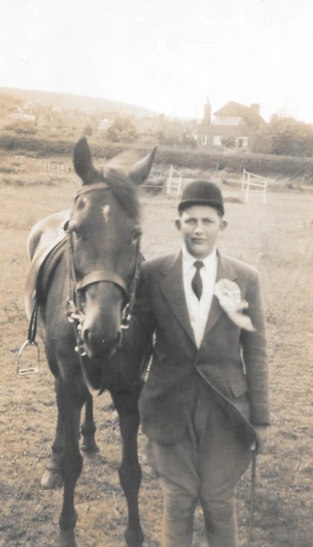 With a rosette at a riding competition